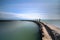 Storm surge barrier breakwater. Concrete block breakwater in port. Sea landscape