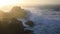 Storm waves at cape Dyrholaey in Iceland. Stormy sunrise.