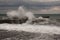 Storm waves over harbor at sea. Sea storm with waves crashing against the pier