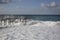 Storm waves and sea foam on the sandy Black Sea coast