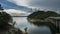 Storms approaching a beautiful lake with hills, Dam