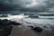 stormy beach with crashing waves and dramatic sky