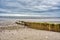 Stormy Beach with Weathered Dock