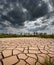 Stormy Clouds And Cracked Land