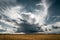 Stormy clouds in the golden fields.