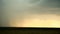 Stormy clouds are gray-blue over the field with grain wheat Evening time sunset dark Summer slide