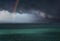 stormy clouds over the sea with a rainbow