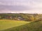 Stormy couds and sunset sky over fields