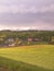 Stormy couds and sunset sky over fields