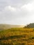 Stormy couds and sunset sky over fields