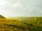 Stormy couds and sunset sky over fields