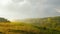 Stormy couds and sunset sky over fields