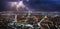 Stormy day in Paris with lightnings over the Eiffel Tower and Paris from Montparnasse tower at night