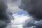 stormy grey and white clouds on blue sky background