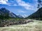 Stormy mountain river at the foot of the Altai snow-capped mountains. Concept of travel and extreme relaxation.