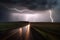 Stormy road: illuminated by thunderous lightning