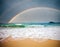 Stormy sea and cloudy sky with rainbow