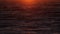 Stormy sea at Sunset, natural dramatic seascape. Sunset or Sunrise sun shining through golden waves, Ocean and sea Slow