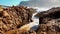 Stormy Sea water rushing in between rocks on the coast