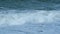 Stormy Seascape. Blue Water Of Ocean Crashing. Breaking Surf With Foam In Ocean. Slow motion.