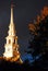 Stormy skies begin to clear over a churchâ€™s steeple