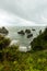 Stormy skies over coastal rock formations at Arch Rock Viewpoint, Oregon, USA