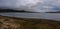 Stormy sky above calm water landscape