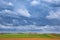 Stormy sky over green field in Bavaria Germany