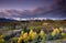 Stormy sky over San Juan Mountain range and Autumn Fall color of Dallas Divide Ridgway Colorado America