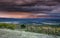 Stormy sky at sunset over San Juan Mountain range and Autumn Fall color of the Dallas Divide Ridgway Colorado