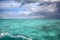 Stormy tropical sky over turquoise water, Caribbean sea off Grand Cayman