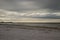 Stormy view of sunrise along beachfront along Fort Myers Beach, Florida.