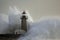 Stormy wave over lighthouse