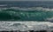 Stormy waves breaking on the shore on a sunny day at Cape Tobizin, Russian Island, Vladivostok