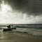 Stormy weather and fishing boat stranded on a beach