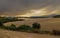 Stormy weather over harvested wheat fields