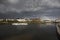 Stormy weather and a rainbow over the lake with swan boats in Newcastle, County Down