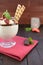 Stracciatella cream with whipped cream, chocolate and strawberries