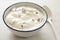 Stracciatella yogurt in small bowl with white spoon
