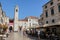 The Stradun main street, cafe and clock tower in Dubrovnik`s old town, Croatia