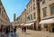 The Stradun main street and shops in Dubrovnik`s old town in summer, Croatia