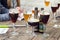 Straffe Hendrik and Brugse Zot belgian beers on wooden table