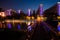 Straight bridge across the river; night view of the community park