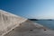 A straight cement road leading to the wharf