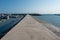 A straight cement road leading to the wharf