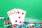 Straight combination under the water drops and falling poker chips against green background. Online gambling. Betting.