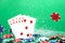 Straight combination under the water drops and falling poker chips against green background. Online gambling. Betting.