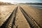Straight engine tyre trace track on a sandy beach in hendaye