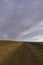 A straight farm track heading up a gentle slope as part of the Angus Coastal footpath.