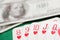 Straight flush of hearts cards during poker with dollar bills on green table